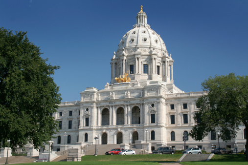 The Minnesota state capitol building exterior, it houses the State Senate, House of Representatives, Attorney General, the office of the Governor, and the Minnesota Supreme Court, in St. Paul, Minnesota, USA.