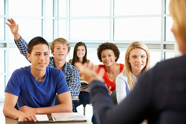 istock Multi racial teenage pupils in class 184936946