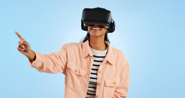 istock Virtual reality, press on screen and woman with future technology and smile in studio on blue background. Hologram, 3D and metaverse, digital world and high tech with user experience and VR software 1849374126