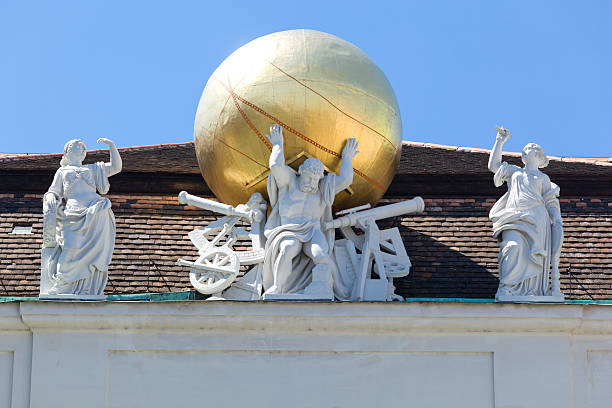 Sculpture of Hercules which kills the Nemean Lion in south-western facade of Imperial Chancellery of the St. Michael's Wing of the Hofburg in sunny day, Vienna, Austria