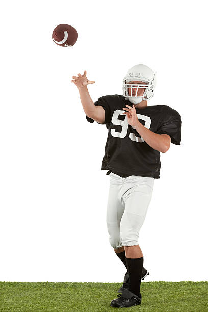 Center prepares to hike the football to the quarterback. Line of scrimmage. 