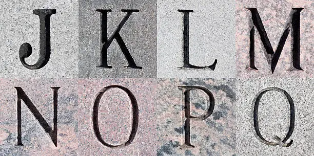 "Letters J, K, L, M, N, O, P, Q, engraved into stone squares. Clipping path included around each letter tile."