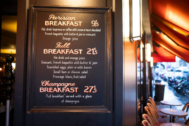 Breakfast menu outside a cafe A wet and rainy morning in Paris menu board outside a french restaurant stock pictures, royalty-free photos & images