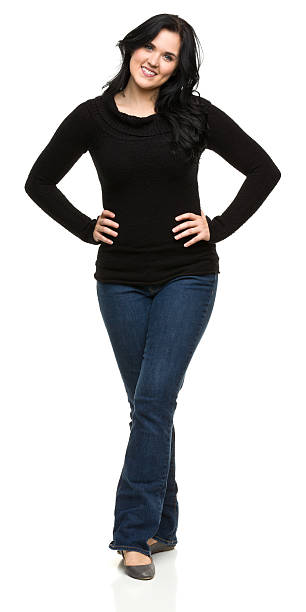 istock Smiling Young Woman Standing With Legs Crossed 184939083