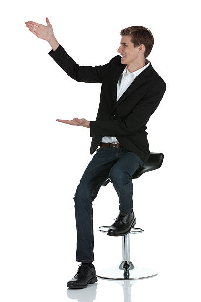 istock Happy sitting on a chair and gesturing 184939289