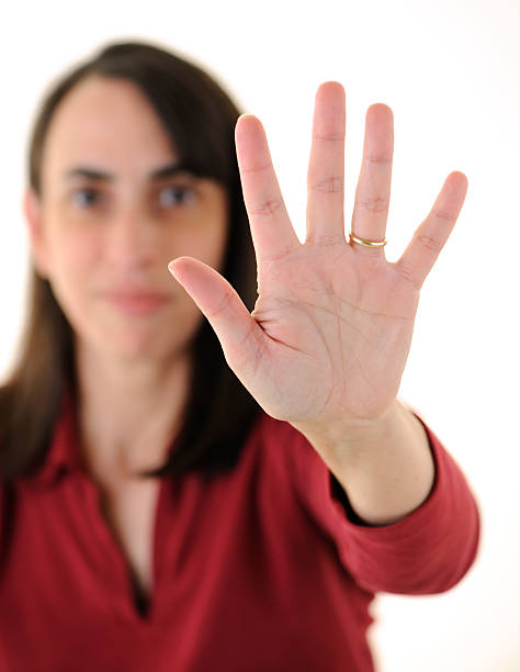 istock Woman Holding Up Five Fingers 184939356