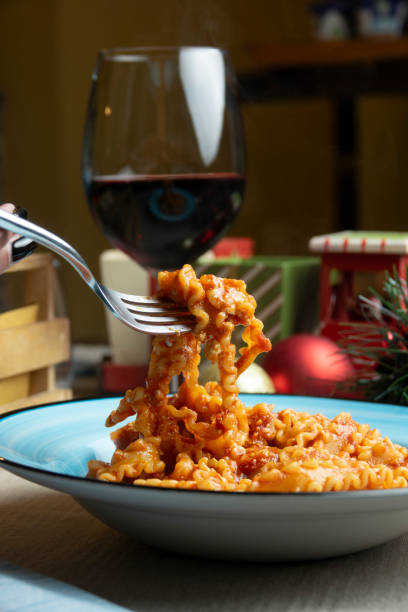 Pasta dish with tomato and ricotta with Christmas decorations