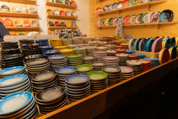 Multi-coloured ceramic plates are sold at the fairgrounds