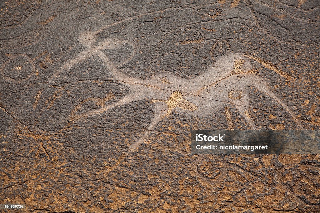 Ancient rock art, Namibia "Ancient bushmen rock engravings (petroglyphs) at Twyfelfontain in Damaraland, Namibia" Cave Painting Stock Photo