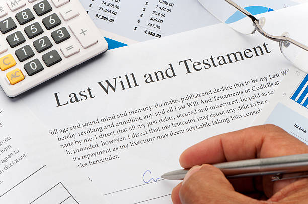 Close up of a Will document Close up of a Will document with writing hand probate stock pictures, royalty-free photos & images