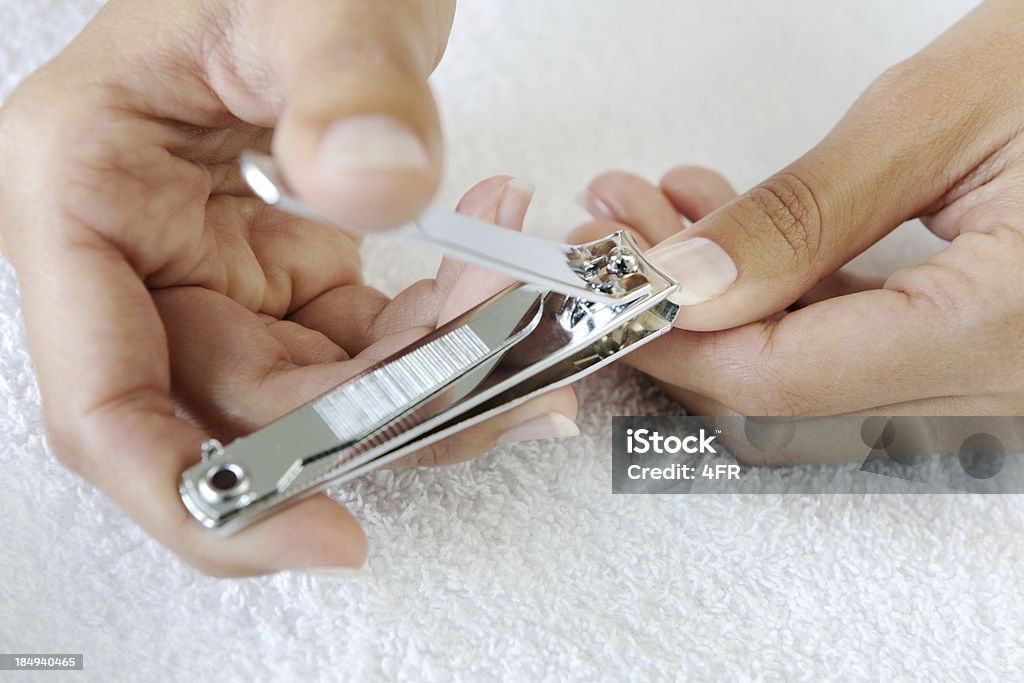 Cutting Nails, Nail Clipper (XXXL) "Natural groomed fingers cutting Nails, Nail Clipper (XXXL)" Fingernail Stock Photo