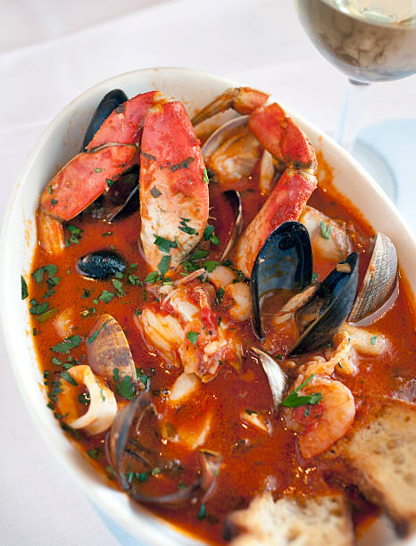 Cioppino "A large bowl of fresh seafood cioppino, with crab legs, mussels, calamari, clams, shrimp and chunks of fish." fishermans wharf san francisco photos stock pictures, royalty-free photos & images