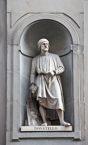 Statue of Donatello outside the Uffizi Gallery, Florence "Statue of Donatello (Donato di NiccolA di Betto Bardi) (c1386 aa 1466), famous Italian/Florentine artist and sculptor; sculpted by Giovanni Bastianini and Girolamo Torrini in 1848. In the portico outside the Uffizi Gallery in Florence." donatello italian sculptor stock pictures, royalty-free photos & images