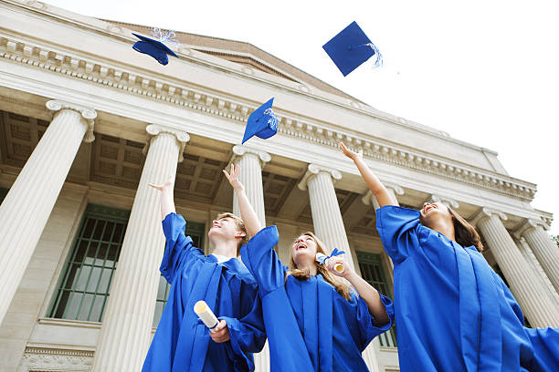 istock High School Students Throwing Mortar Boards in Graduation Ceremony Celebration 184941198