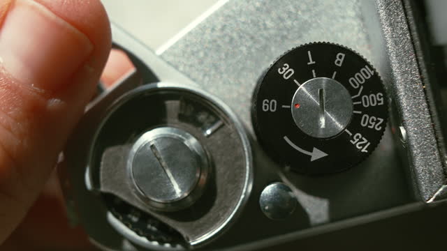 Adjusting SLR Single-lens reflex vintage film camera