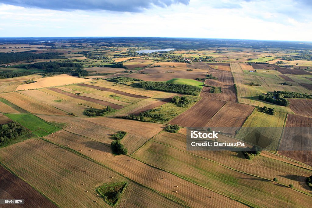 An aerial view of brown and green farmland Aerial photo taken in Poland. http://marcinskiba.nazwa.pl/darek/farmland.JPG Above Stock Photo