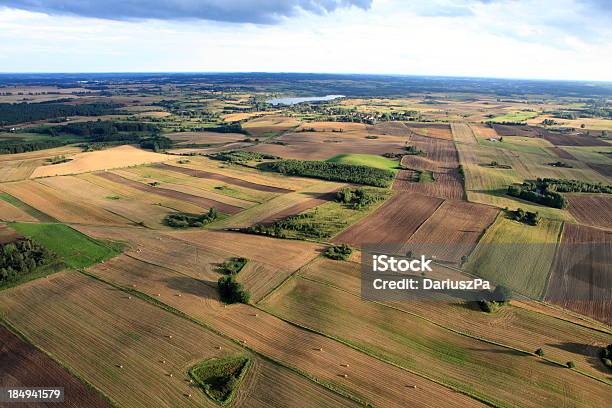 An Aerial View Of Brown And Green Farmland Stock Photo - Download Image Now - Above, Aerial View, Agricultural Field