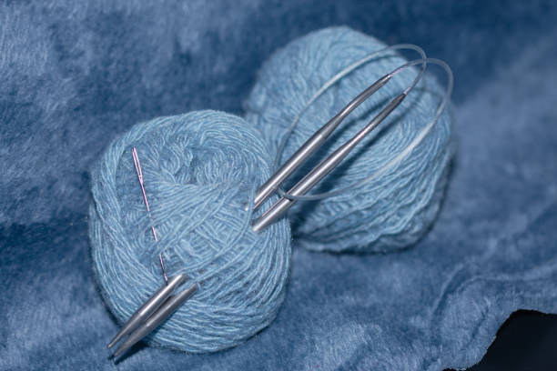 istock blue yarn and knitting needle on plaid 1849417600
