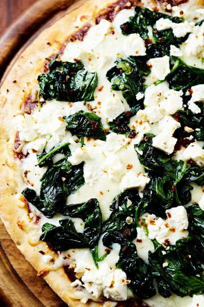 istock Pizza with mozzarella cheese and spinach. Top view. Close up. 1849418677