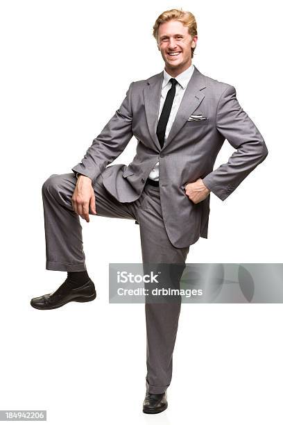 Man Pretending To Rest Foot On A Box Stock Photo - Download Image Now - 20-24 Years, 20-29 Years, 25-29 Years
