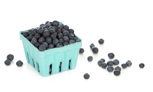 A pint container of blueberries from a local market.