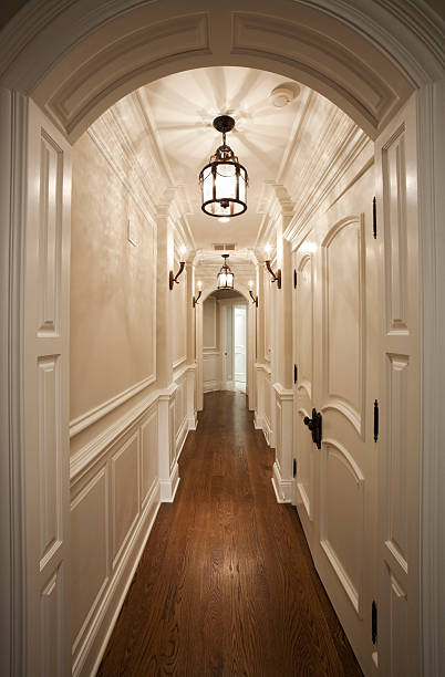 Elegant white hallway with hardwood floor.