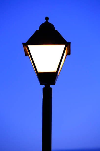 istock Old style street light against evening sky. 184942624