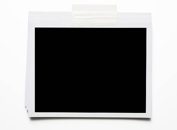 istock Stacked blank Polaroid with adhesive tape on white background 184942997