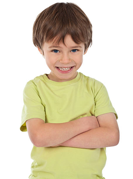 istock Young boy on white background with cheeky grin 184943884
