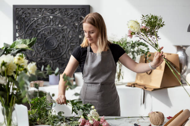istock Female florist working with flowers 1849439908