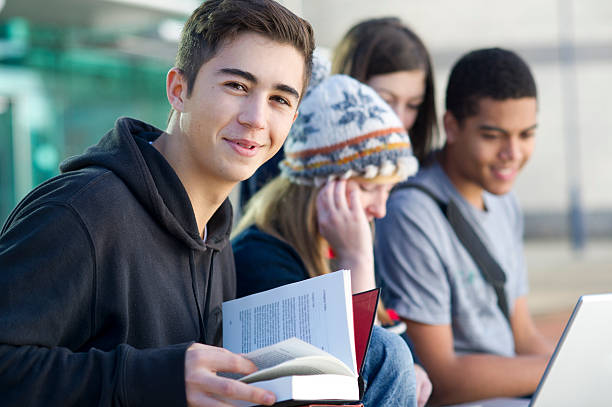 teen study group of students studying outdoors high school building stock pictures, royalty-free photos & images