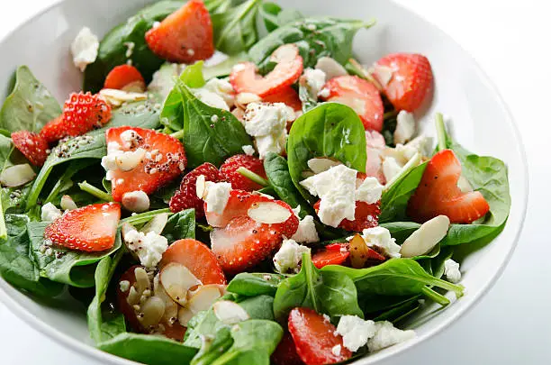 Photo of Green salad with strawberries and spinach