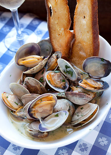 Sauteed clams with garlic Sauteed clams with garlic served at a San Francisco restaurant fishermans wharf san francisco photos stock pictures, royalty-free photos & images