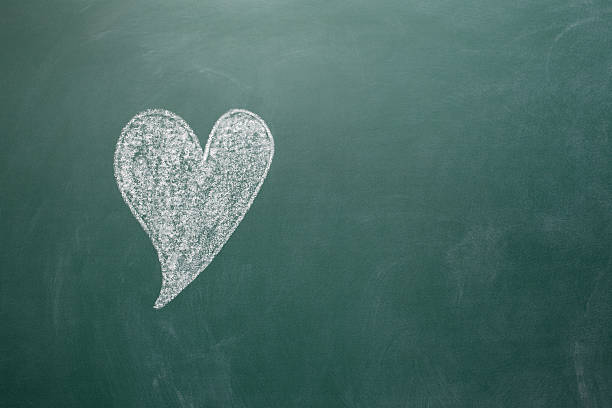istock Heart shape on green blank blackboard 184944553