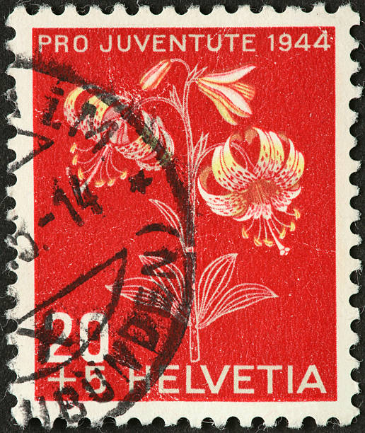 istock small spotted flower on an old Swiss postage stamp 184944624