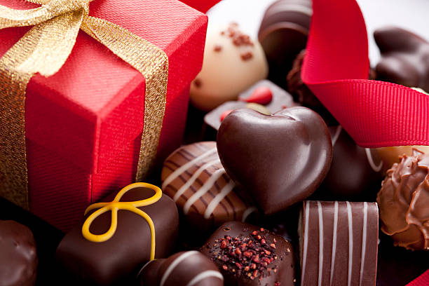 Chocolate Candies and Gift Box Chocolate Candies and Gift Box. Selective Focus. valentines present stock pictures, royalty-free photos & images