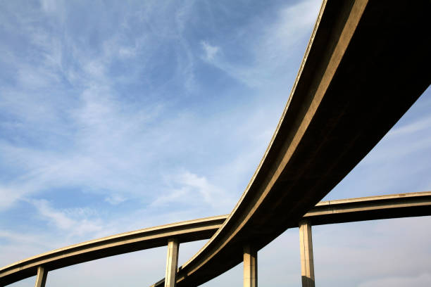 Freeway span from below view with the sky stock photo