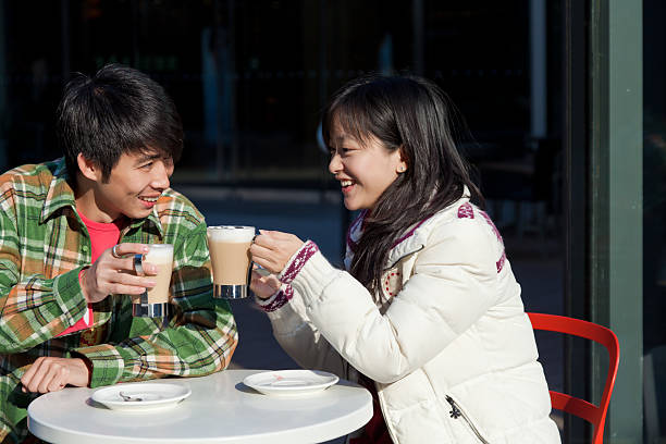 young couple drinking coffee in the dating