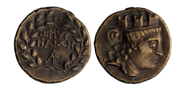 A closeup shot of an ancient Roman denarius coin with emperor Vitellius inscription