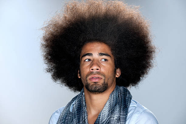 istock worried man with big afro hair 184945670