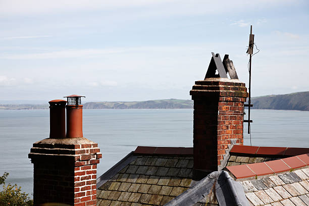 istock Brick chimneys on house by the sea 184945756