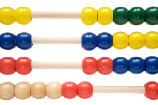 Multi colored abacus beads isolated on a white background.