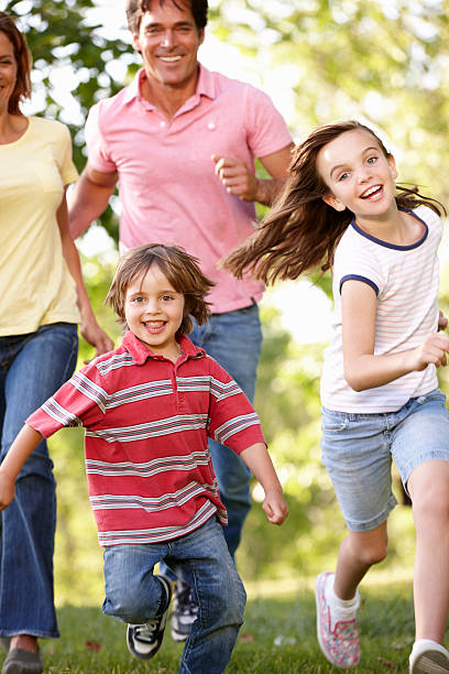 istock Family running in park 184946445