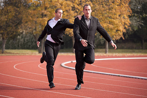 istock unfair businessman holding his rival 184947279
