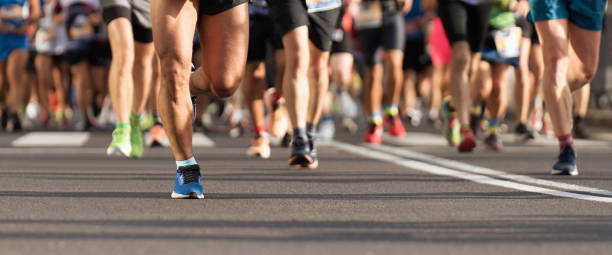 istock Marathon runners running on city road 1849480484