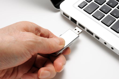 Close-up of connecting USB flash drive on white background.Studio shot.