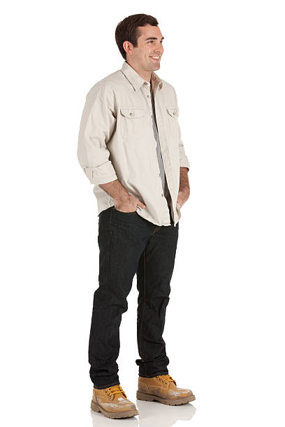 istock Man standing with hands in his pockets 184948937