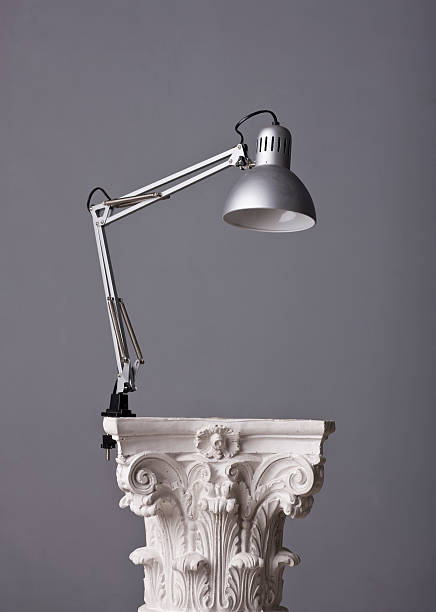gooseneck office lamp on a corinthian capital