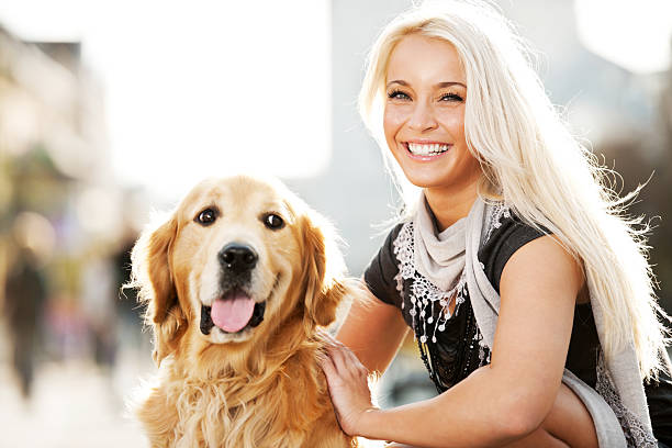 istock Smiling blonde female and her dog 184949771