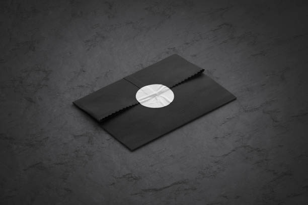 istock Blank black rectangle paper bag with sticker mockup, stone background 1849499881